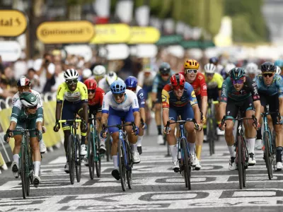 Cycling - Tour de France - Stage 21 - Saint-Quentin-En-Yvelines to Paris Champs-Elysees - France - July 23, 2023 Bora&ndash;Hansgrohe's Jordi Meeus crosses the finish line to win stage 21 alongside Alpecin&ndash;Deceuninck's Jasper Philipsen, Team Jayco&ndash;AlUla's Dylan Groenewegen and Lidl&ndash;Trek's Mads Pedersen REUTERS/Stephane Mahe