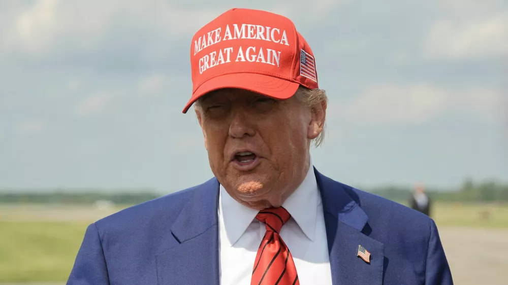 U.S. President Donald Trump talks to reporters upon his arrival at Morristown Municipal Airport in Morristown, New Jersey, U.S., June 20, 2025. REUTERS/Ken Cedeno