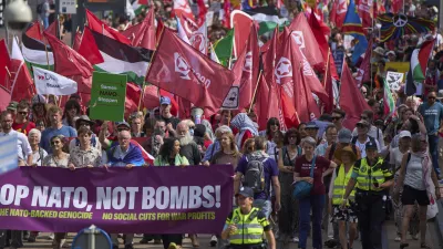 People carry banners and flags during a demonstration ahead of the NATO summit in The Hague, Netherlands, Sunday, June 22, 2025. (AP Photo/Peter Dejong)