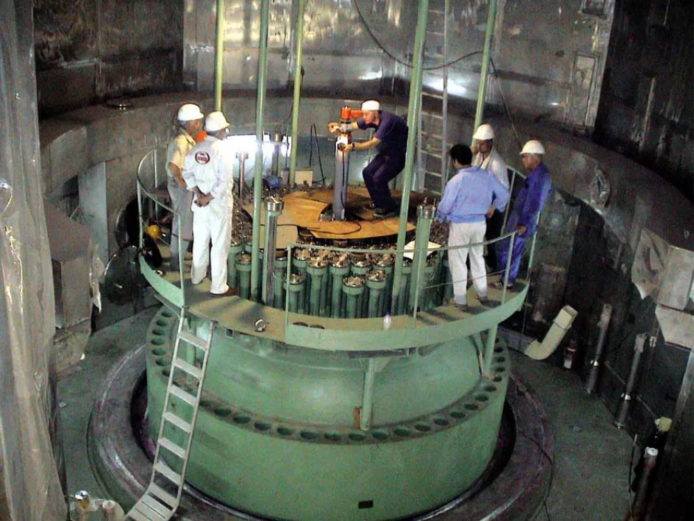Technicians, measure part of the reactor of Iran's Boushehr nuclear power plant, southwest of the capital Tehran, Iran, in this undated photo released by Iran's Atomic Energy Organization Sunday Aug. 22 2004. Iran said Sunday it was planning to build more nuclear power plants with Russian help, ignoring U.S. concerns that byproducts from the plants could be used to manufacture atomic bombs. (AP Photo/Iranian Atomic Energy Organization)