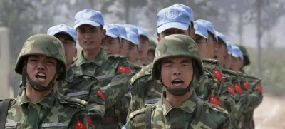 Chinese soldiers from an engineering unit practice at an army camp in Qinyang in Henan province September 15, 2007. The soldiers are a part of a 315-member multi-functional unit that will go for a United Nations peacekeeping mission in the Darfur region of Sudan in the near future. The peacekeeping mission will build and maintain barracks, roads, helipads and bridges, the army said. REUTERS/Reinhard Krause (CHINA)