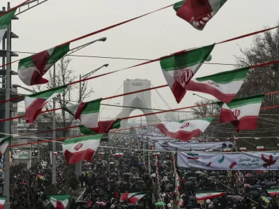 11 February 2019, Iran, Tehran: People gather in front of the Azadi Tower at the Azadi Square during a ceremony marking the 40th anniversary of the Iranian Islamic Revolution. Photo: Saeid Zareian/dpa