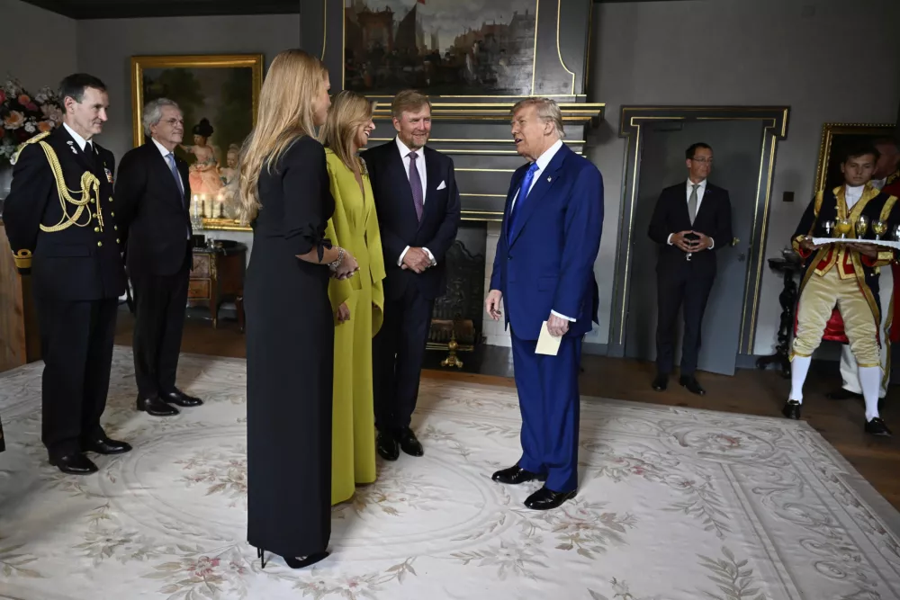 President Donald Trump, center, is welcomed by Netherland's King Willem Alexander, Netherland's Queen Maxima and Netherland's Crown Princess Amalia as he arrives for a formal dinner at the Paleis Huis ten Bosch ahead of the NATO summit in The Hague, Netherlands, Tuesday, June 24, 2025. (Misha Schoemakers, Pool Photo via AP)