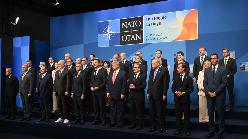 Netherlands' Prime Minister Dick Schoof, front row from fifth left, NATO Secretary General Mark Rutte, US President Donald Trump, Britain's Prime Minister Keir Starmer and Turkey's President Recep Tayyip Erdogan pose with NATO country leaders for a family photo during the NATO summit in The Hague, Netherlands, Wednesday, June 25, 2025. (Ben Stansall/Pool Photo via AP)