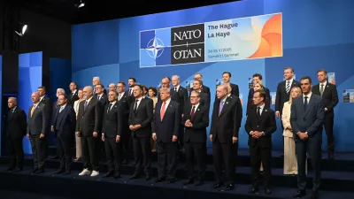 Netherlands' Prime Minister Dick Schoof, front row from fifth left, NATO Secretary General Mark Rutte, US President Donald Trump, Britain's Prime Minister Keir Starmer and Turkey's President Recep Tayyip Erdogan pose with NATO country leaders for a family photo during the NATO summit in The Hague, Netherlands, Wednesday, June 25, 2025. (Ben Stansall/Pool Photo via AP)