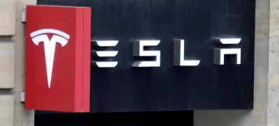 FILE PHOTO: The logo of Tesla is seen on a store in Paris, France, October 30, 2020. REUTERS/Charles Platiau/File Photo