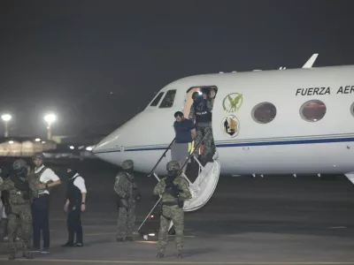 Escorted by soldiers and policemen, Adolfo "Fito" Macias, the leader of the Choneros gang, arrives in Guayaquil, Ecuador, Wednesday, June 25, 2025. (AP Photo/Joffre Flores)