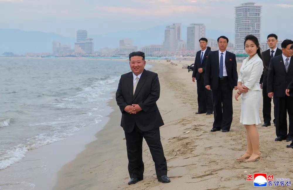 North Korean leader Kim Jong Un and his daughter Kim Ju Ae stand on the beach during a ceremony to celebrate the completion of the Wonsan Kalma Coastal Tourist Zone, in Wonsan, North Korea, June 24, 2025. KCNA via REUTERS  ATTENTION EDITORS - THIS IMAGE WAS PROVIDED BY A THIRD PARTY. REUTERS IS UNABLE TO INDEPENDENTLY VERIFY THIS IMAGE. NO THIRD PARTY SALES. SOUTH KOREA OUT. NO COMMERCIAL OR EDITORIAL SALES IN SOUTH KOREA.