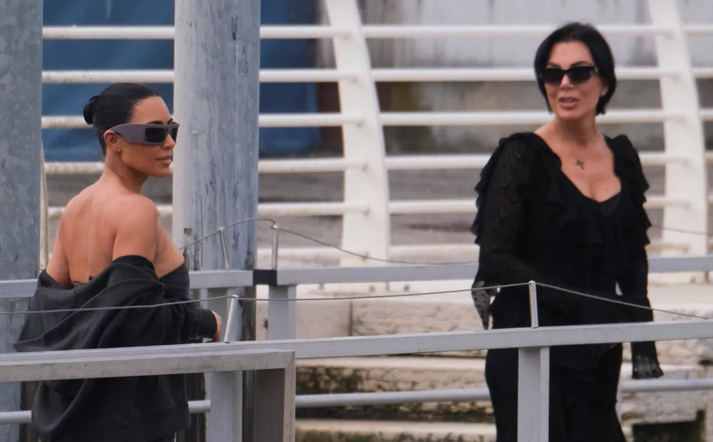 Kim Kardashian and Kris Jenner walk to get in a boat as they depart from Marco Polo Airport ahead of the anticipated wedding of Amazon founder Jeff Bezos and Lauren Sanchez in Venice, Italy, June 26, 2025. REUTERS/Manuel Silvestri