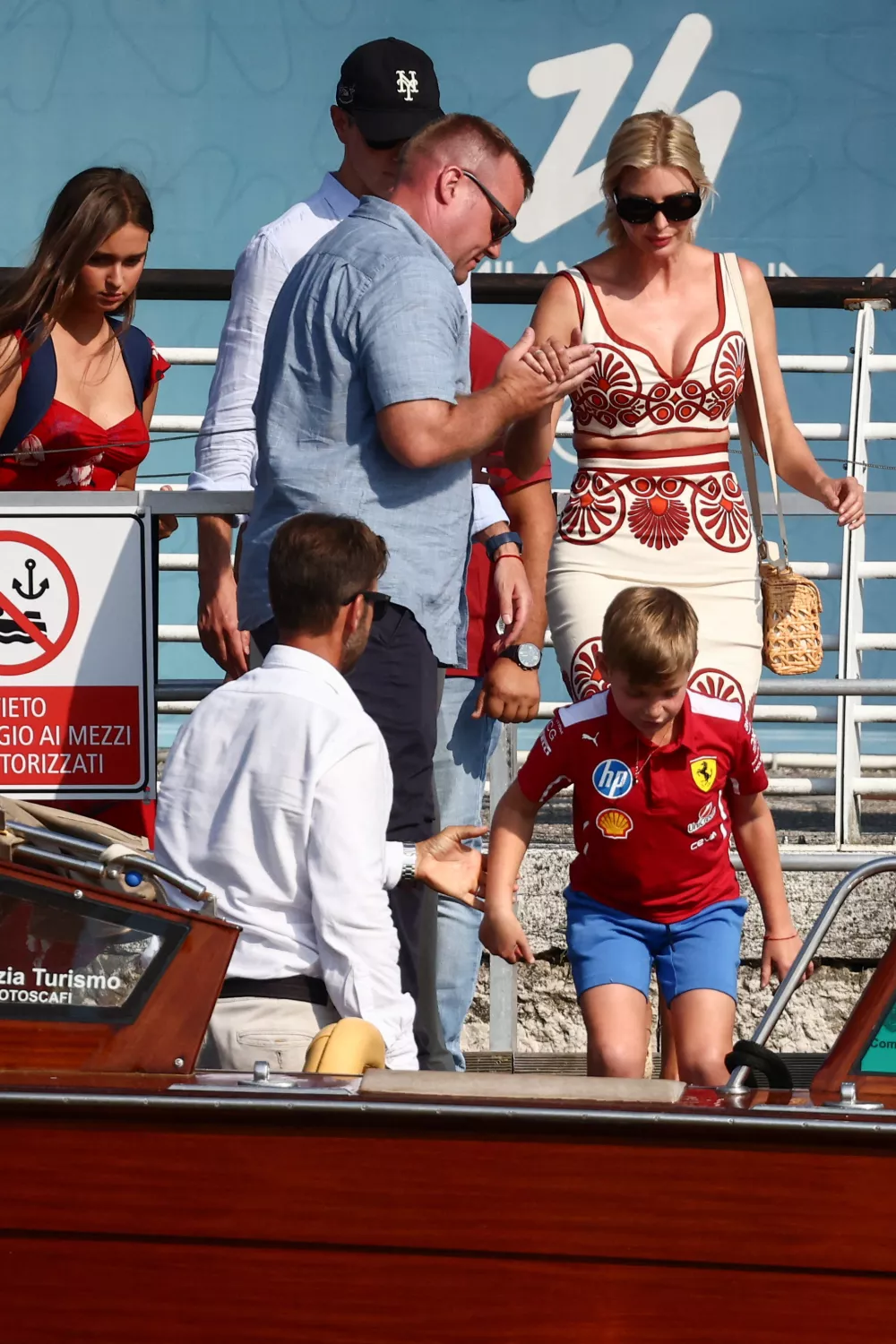 Ivanka Trump, daughter of U.S. President Donald Trump, is assisted while getting into a water taxi, as she and her husband Jared Kushner and children arrive at the airport, ahead of the wedding of Amazon founder Jeff Bezos and Lauren Sanchez, in Venice, Italy, June 24, 2025. REUTERS/Yara Nardi
