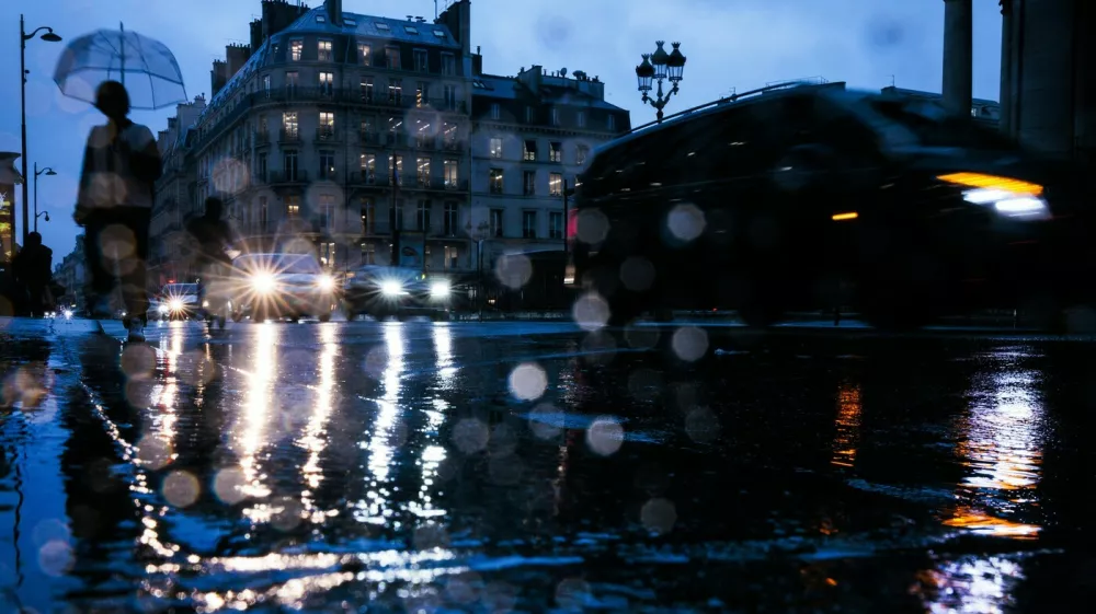 A pedestrian walks down a flooded street following heavy rainfall which has been placed on orange alert Paris and and part of Ile-de-France for rain and flooding and on red alert six other departments, in Paris, on October 17, 202.,Image: 922550887, License: Rights-managed, Restrictions:, Model Release: noFoto: Profimedia