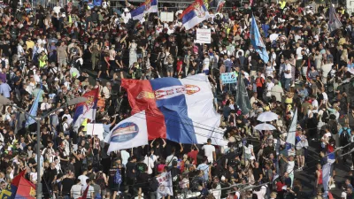 People attend a major anti-government rally to press their demand for an early election after nearly eight months of almost daily anti-corruption demonstrations that have shaken the populist government of President Aleksandar Vucic, in Belgrade, Serbia, Saturday, June 28, 2025. (AP Photo/Marko Drobnjakovic)