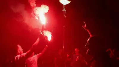 People hold smoke flares during an anti-government protest by Serbian students and other demonstrators, demanding snap elections, near the Slavija Square, in Belgrade, Serbia, June 28, 2025. REUTERS/Zorana Jevtic