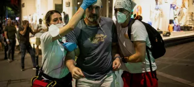 An injured demonstrator is helped during an anti-government protest demanding snap elections, in Belgrade, Serbia, June 28, 2025. REUTERS/Marko Djurica