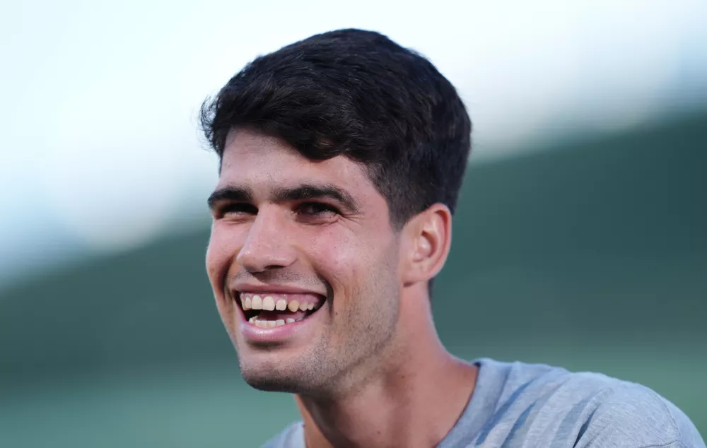 28 June 2025, United Kingdom, London: Spanish tennis player Carlos Alcaraz speaks to the media at the All England Lawn Tennis and Croquet Club in Wimbledon ahead of the Wimbledon Championships. Photo: John Walton/PA Wire/dpa