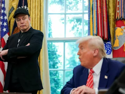 FILE PHOTO: U.S. President Donald Trump and Elon Musk attend a press conference in the Oval Office of the White House in Washington, D.C., U.S., May 30, 2025. REUTERS/Nathan Howard/File Photo