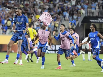 Al Hilal players celebrate following the Club World Cup round of 16 soccer match between Manchester City and Al Hilal in Orlando, Fla., Monday, June 30, 2025. (AP Photo/John Raoux)