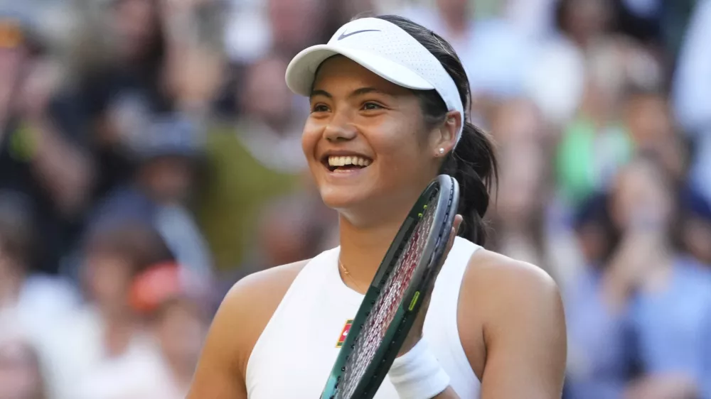 Emma Raducanu of Britain celebrates winning the second round women's singles match against Marketa Vondrousova of the Czech Republic at the Wimbledon Tennis Championships in London, Wednesday, July 2, 2025.(AP Photo/Kirsty Wigglesworth)