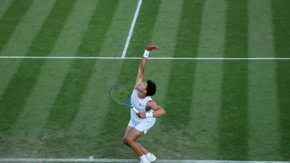 Tennis - Wimbledon - All England Lawn Tennis and Croquet Club, London, Britain - July 3, 2025 Ben Shelton of the U.S. in action during his second round match against Australia's Rinky Hijikata REUTERS/Toby Melville