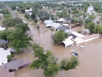 A drone view shows flooded houses, following torrential rains that unleashed flash floods along the Concho River in San Angelo, Texas, U.S., July 4, 2025, in this screen grab obtained from a social media video. Patrick Keely via REUTERS  THIS IMAGE HAS BEEN SUPPLIED BY A THIRD PARTY. MANDATORY CREDIT. NO RESALES. NO ARCHIVES.   TPX IMAGES OF THE DAY   REFILE - CORRECTING NAME OF RIVER FROM "GUADALUPE" TO "CONCHO" AND MONTH FROM "JUNE" TO "JULY