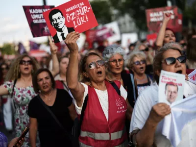 Women shout slogans during a protest called by the main opposition Republican People's Party or (CHP), outside the City Hall in Istanbul, Turkey, Tuesday, July 1, 2025. (AP Photo/Francisco Seco)