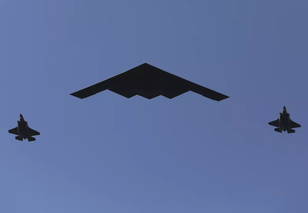 A B-2 bomber and two F-22 fighters conduct a flyover during a Fourth of July celebration at the White House, Friday, July 4, 2025, in Washington. (AP Photo/Rahmat Gul)