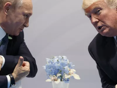 FILE &ndash; Then-U.S. President Donald Trump, right, meets with Russian President Vladimir Putin at the G20 Summit in Hamburg, Germany, Friday, July 7, 2017. (AP Photo/Evan Vucci, File)