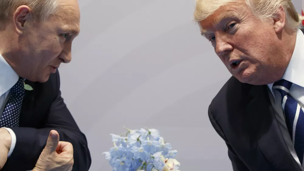 FILE &ndash; Then-U.S. President Donald Trump, right, meets with Russian President Vladimir Putin at the G20 Summit in Hamburg, Germany, Friday, July 7, 2017. (AP Photo/Evan Vucci, File)