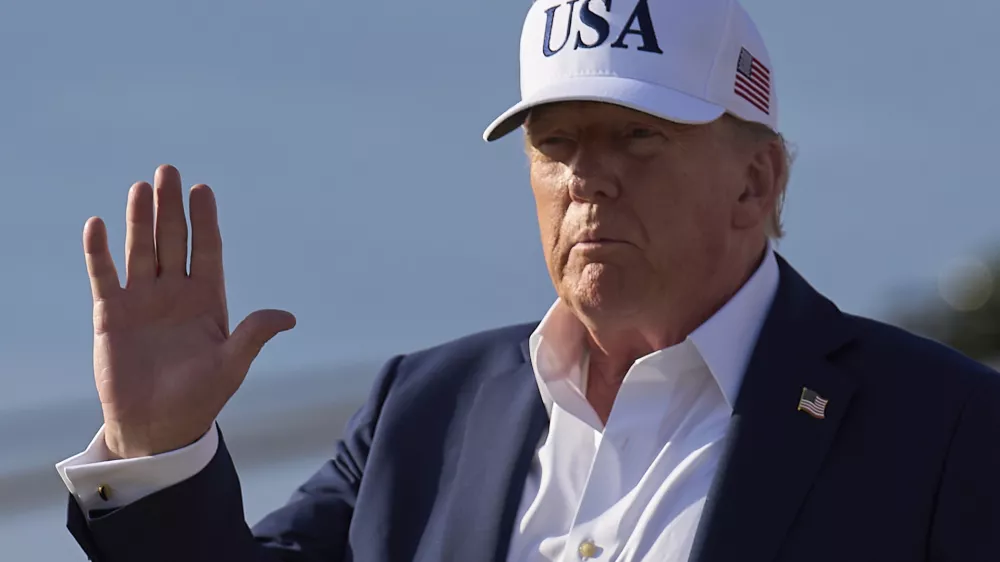 President Donald Trump waves to the media after exiting Air Force One, at Joint Base Andrews, Md., Sunday, July 6, 2025, en route to the White House after spending the weekend in New Jersey. (AP Photo/Jacquelyn Martin)