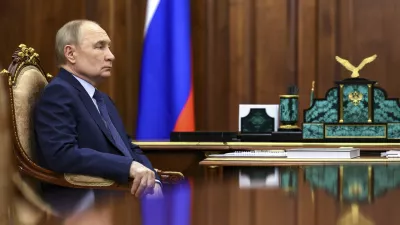 Russian President Vladimir Putin listens to Archpriest Alexander Tkachenko, Chairman of the Board of the Circle of Kindness Foundation and head of the commission for social partnership, trusteeship, and inclusive practices at the Russian Civic Chamber, at the Kremlin in Moscow, on Friday, May 30, 2025. (Alexander Kazakov, Sputnik, Kremlin Pool Photo via AP)