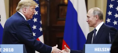 FILE - U.S. President Donald Trump shakes hands with Russian President Vladimir Putin at the end of a news conference at the Presidential Palace in Helsinki, Finland, on July 16, 2018. (AP Photo/Alexander Zemlianichenko, File)