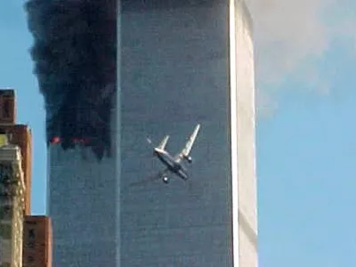 ** ADVANCE FOR TUESDAY, NOV. 4, 2008 AND THEREAFTER ** FILE ** In this Sept. 11, 2001 file photo, a jet airliner nears one of the World Trade Center towers in New York. For all of the candidates' talk about the need for change, Americans have seen plenty of it since the last time they selected a new leader - including the attack on the World trade Center in 2001. (AP Photo/Carmen Taylor/File)