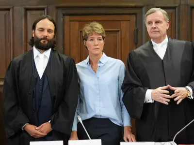 German entrepreneur and gastronome Christina Block and her lawyers Otmar Kury and Ingo Bott wait for the start of her trial at the regional court in Hamburg, Germany, July 11, 2025. Marcus Brandt/Pool via REUTERS