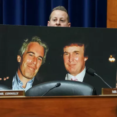 Rep. Jared Moskowitz (D-FL) holds up a photo of former U.S. President Donald Trump with late sex offender Jeffrey Epstein during a meeting of the the House Oversight and Accountability Committee to markup a resolution and report to hold Hunter Biden, President Joe Biden's son, in contempt of Congress, after he refused to appear for a closed-door deposition, at the Capitol in Washington, U.S., January 10, 2024. REUTERS/Kevin Lamarque