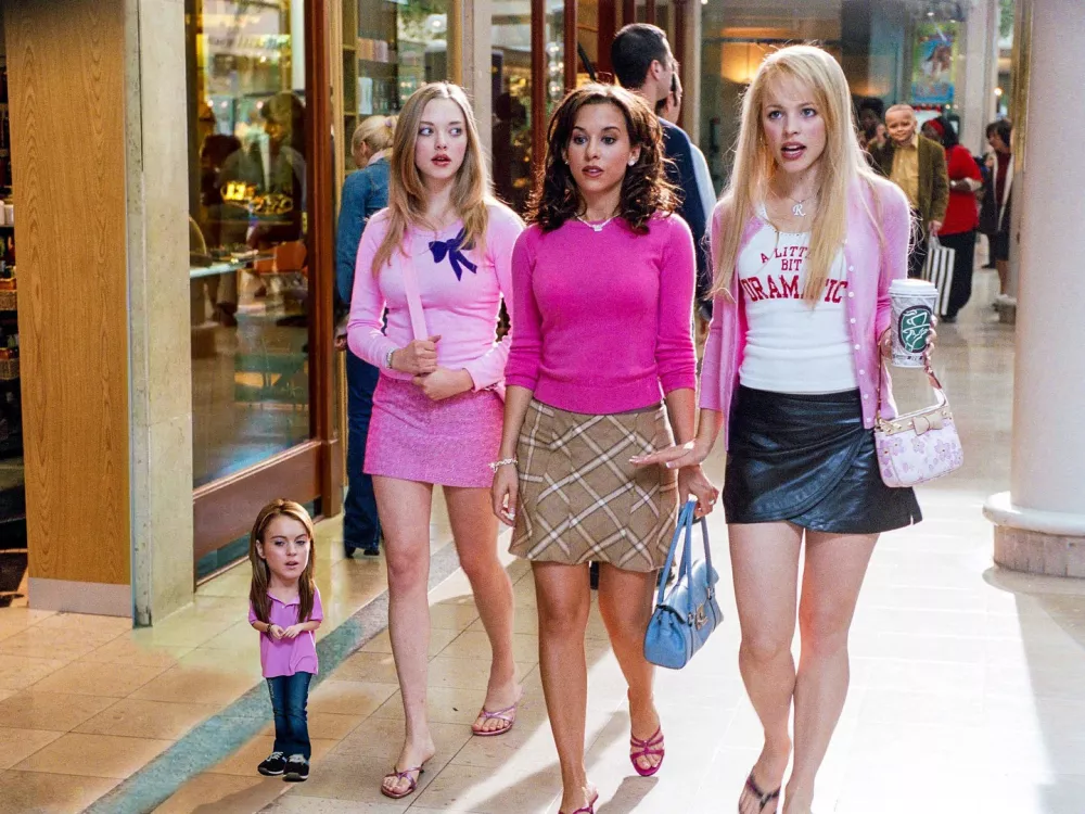 Story from Jam Press (Mini Movies)Pictured: Mean Girls. Artist turns celebs into hilarious pint-sized movie stars &ndash; and Dua Lipa's a fanMonterrey-based content creator Oscar Hinojosa has a very particular set of skills &mdash; the kind that involves making movie heroes small enough to fit in your pocket. Using nothing but Photoshop, a well-timed brownie, and the brainchild of one very tiny dog, Oscar has carved out a delightfully odd digital niche: creating "mini celebrities" from film, sport, and pop culture.His inspiration? A pint-sized pup and a weekend experiment with a "special brownie." Oscar recalls staring at his miniature mutt and thinking, "What would I look like if I were that tiny?" One Photoshop session later, he had his answer. Since then, he's miniaturized everyone from Michael J. Fox in Back to the Future to a shrunken Will Smith fending off miniature monsters in I Am Legend. "It's nostalgic and fun," he says."As long as people keep enjoying it, I'll keep creating." And enjoy it, they do. Oscar's micro-makeovers of Gladiator's Russell Crowe wielding a thimble-sized sword, or Cillian Murphy brooding in a baby Peaky Blinders cap, have earned him thousands of likes and a few celebrity reposts. Finneas (Billie Eilish's brother) is a serial sharer, and Oscar suspects he might be using the mini edits to tease his sister. Meanwhile, Dua Lipa gave one of his posts her stamp of approval &mdash; a moment he describes as "surreal."Each piece takes about 30 minutes now (down from an hour), all crafted manually with Adobe Photoshop &mdash; no AI, just old-school YouTube learning. While some edits are a breeze, like a tiny Kevin from Home Alone defending his micro-house, others like his tennis-themed pieces or Cristiano Ronaldo lifting a mouse-sized trophy take time and a perfect shot. And what's the most common reaction? "People love it when I mini someone who's already short. I get comments like, 'Where's the edit?'" Oscar laughs. With over 30,000 likes on some posts and a global fanbase, Oscar (also known as Phetru) proves that no dream is too small &mdash; literally.ENDS,Image: 1020791296, License: Rights-managed, Restrictions:, Model Release: no