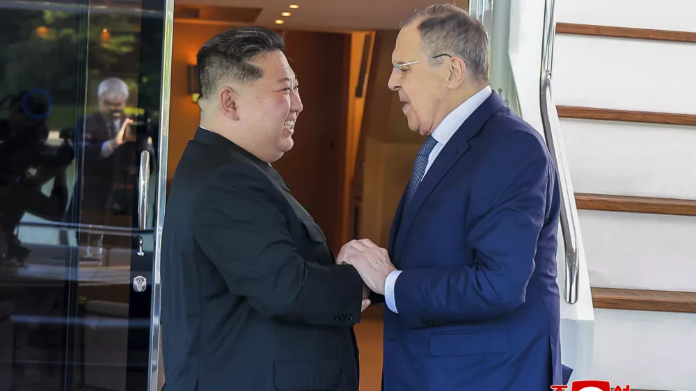 In this photo provided by the North Korean government, its leader Kim Jong Un, left, and Russian Foreign Minister Sergey Lavrov shake hands in Wonsan, North Korea, Saturday, July 12, 2025. Independent journalists were not given access to cover the event depicted in this image distributed by the North Korean government. The content of this image is as provided and cannot be independently verified. Korean language watermark on image as provided by the source reads: "KCNA," which is the abbreviation for Korean Central News Agency. (Korean Central News Agency/Korea News Service via AP)