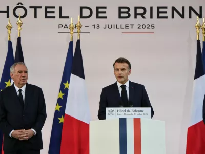 France Prime Minister Francois Bayrou listens as President of France Emmanuel Macron delivers a speech to army leaders, on the eve of the annual Bastille Day Parade in the French capital, at l'Hotel de Brienne in Paris, France July 13, 2025.   LUDOVIC MARIN/Pool via REUTERS