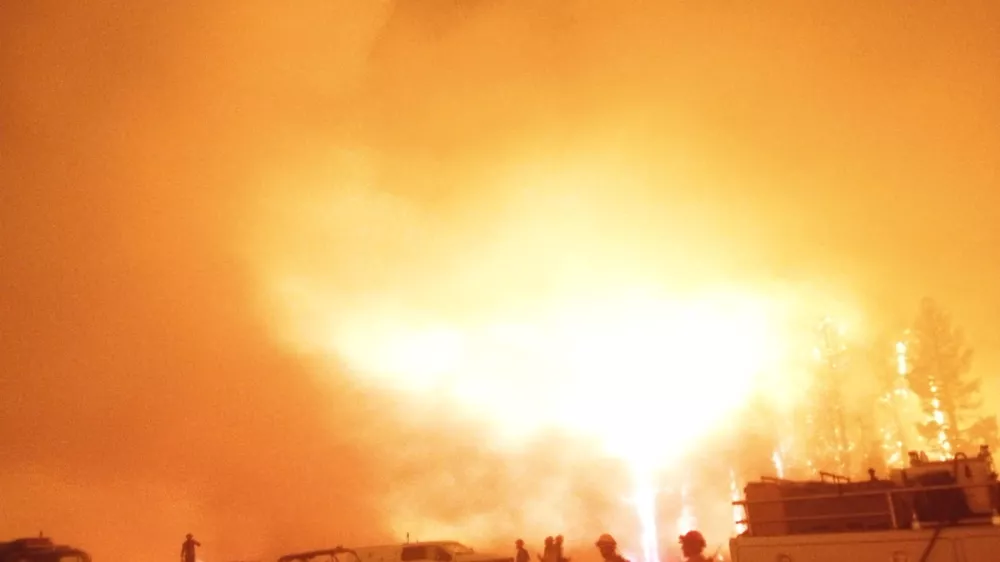 Firefighters and emergency vehicles are positioned in front of the Dragon Bravo Fire in Grand Canyon, Arizona, U.S. in this image released July 13, 2025.  National Park Service/Handout via REUTERS  THIS IMAGE HAS BEEN SUPPLIED BY A THIRD PARTY. MANDATORY CREDIT.