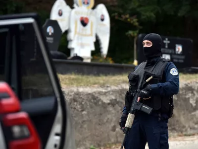 A police officer patrols in the aftermath of a shooting, on the road to Banjska village, Kosovo September 24, 2023. REUTERS/Laura Hasani