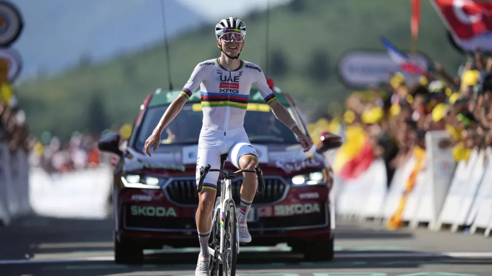 Slovenia's Tadej Pogacar crosses the finish line to win the twelfth stage of the Tour de France cycling race over 180.6 kilometers (112.2 miles) with start in Auch and finish in Hautacam, France, Thursday, July 17, 2025. (AP Photo/Mosa'ab Elshamy)