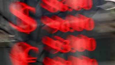 FILE PHOTO: An electronic board shows currency exchange rates of the U.S. dollar and euro against Russian rouble in a street in Moscow, Russia, March 20, 2025. REUTERS/Evgenia Novozhenina/File Photo