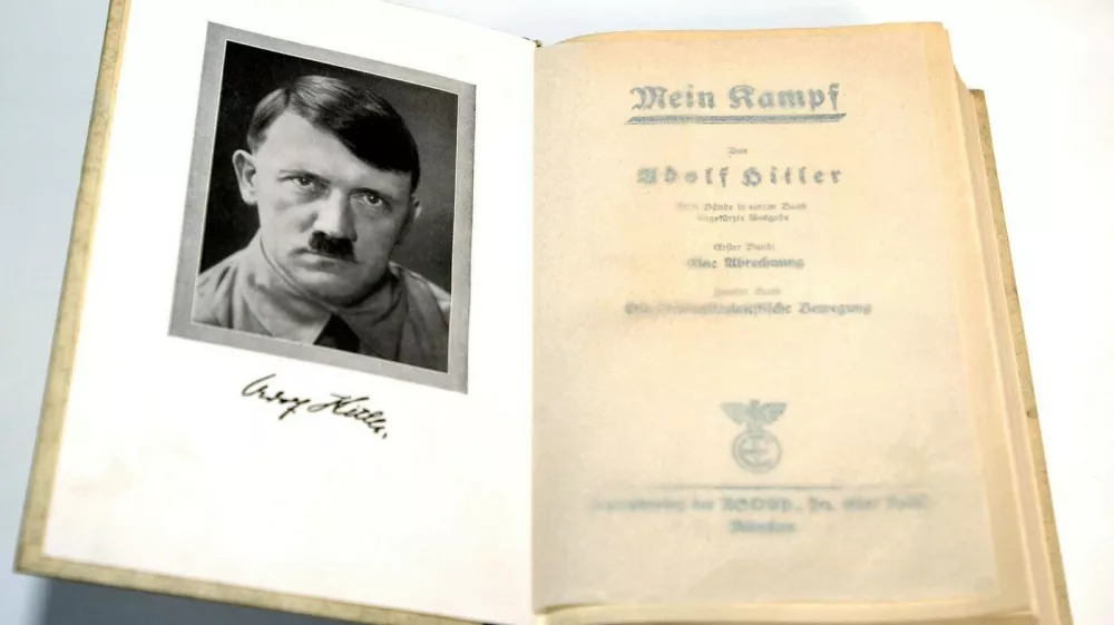 (dpa) - A copy of the first edition of Adolf Hitler's 'Mein Kampf' (My Struggle) features a frontispiece of the Fuehrer, pictured in Germany, 2003. In 1923 Adolf Hitler was arrested for attempting to overthrow the government in Munich and his National Socialist German Workers' Party (the Nazi party NSDAP) was disbanded. While in prison he wrote the first volume of 'Mein Kampf', outlining his political ideas. 'Mein Kampf' was not taken seriously at first, but it includes many of the ideas the Nazis put in practice in the 1930s and 1940s.,Image: 676250941, License: Rights-managed, Restrictions:, Model Release: no