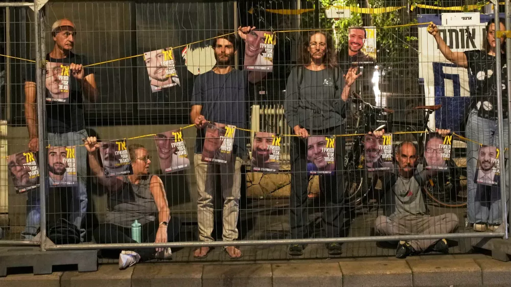 Families and supporters of Israeli hostages held by Hamas in Gaza, attend a protest calling for their release outside the prime minister's house in Jerusalem, Thursday, July. 17, 2025. (AP Photo/Ohad Zwigenberg)