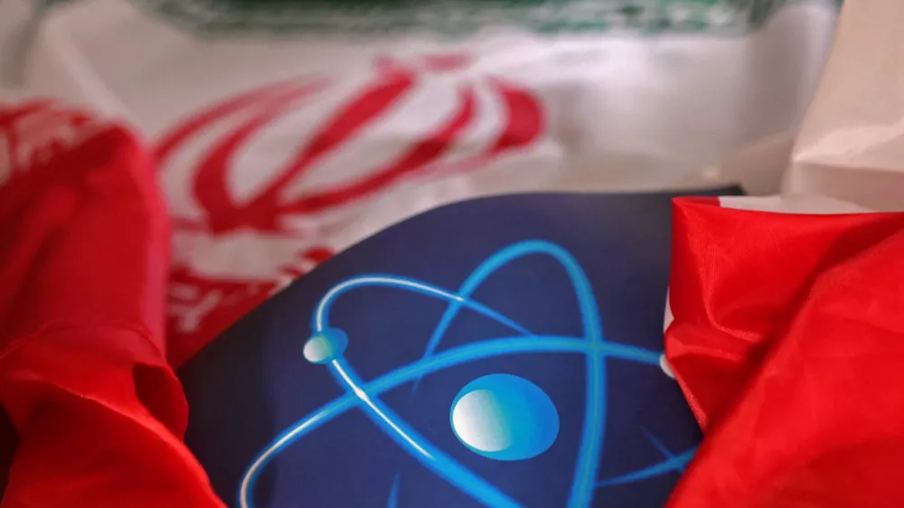 FILE PHOTO: Atomic symbol and Iranian flag are seen in this illustration taken September 8, 2022. REUTERS/Dado Ruvic/Illustration/File Photo