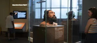 People visit exhibits inside the Smithsonian Hall of Human Origins, Thursday, July 20, 2023, at the Smithsonian Museum of Natural History in Washington. Until recently, the genetic legacy from ancient humans was invisible because scientists were limited to what they could glean from the shape and size of bones. But there has been a steady stream of discoveries from ancient DNA, an area of study pioneered by Nobel Prize winner Svante Paabo who first pieced together a Neanderthal genome. (AP Photo/Jacquelyn Martin)