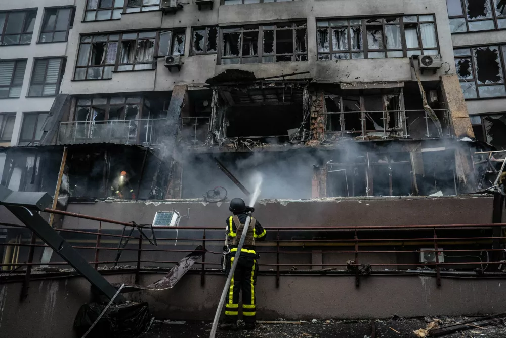 21 July 2025, Ukraine, KievA Ukrainian firefighter extinguishes the fire in a block of flats damaged in a Russian drone attack. PhotoPatryk Jaracz/SOPA Images via ZUMA Press Wire/dpa