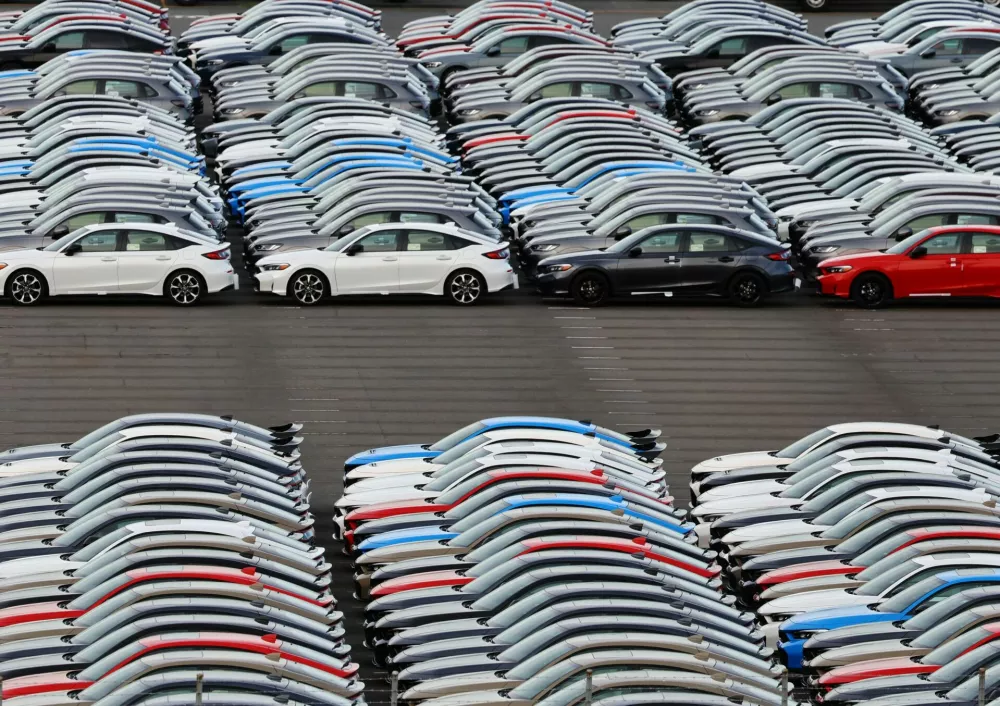 Honda vehicles are lined up at a vehicle storage yard at an industrial port, on the day U.S. President Donald Trump struck a trade deal with Japan that lowers tariffs on auto imports, in Yokohama, near Tokyo, Japan, July 23, 2025. REUTERS/Kim Kyung-Hoon