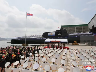 This image, released on September 8, 2023, by the North Korean Official News Service (), shows North Korean leader Kim Jong Un during the launch of the country's first tactical nuclear attack submarine at Sinpho shipyard. According to state media, the tactical nuclear attack submarine, No. 841, the first of its kind, was transferred to the East Sea Fleet of the KPA Navy and named the "Hero Kim Kun Ok." Photo by /UPI,Fotografija:803644111, Licenca:Rights-managed, Omejitve:, Model izdaje:no