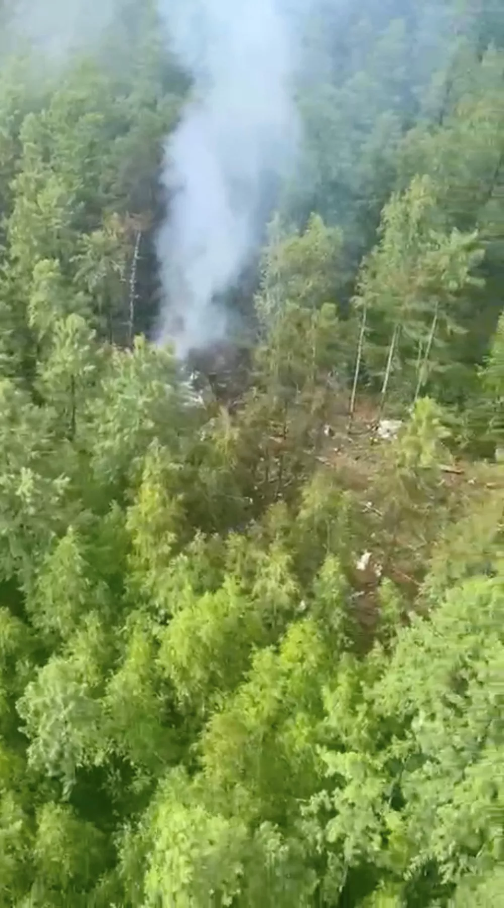 Smoke rises at the crash site of an Angara Airlines An-24 passenger plane near Tynda in the Amur Region, Russia July 24, 2025, in this still image taken from video. Federal Air Transport Agency/Handout via REUTERS ATTENTION EDITORS - THIS IMAGE HAS BEEN SUPPLIED BY A THIRD PARTY. NO RESALES. NO ARCHIVES. MANDATORY CREDIT.