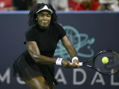 Venus Williams returns the ball against Magdalena Frech, of Poland, during a match at the Citi Open tennis tournament Thursday, July 24, 2025, in Washington. (AP Photo/Nick Wass)